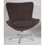 A 1960s Danish chrome and upholstered swivel swan type chair, in the manner of Arne Jacobsen,