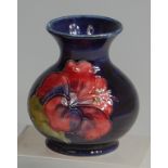 A Moorcroft Anemone pattern pottery miniature squat vase, of bulbous lower form,