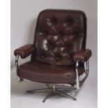 A 1960s Danish tubular chrome and dark tan leather upholstered buttonback and seat swivel open