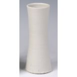 A Bernard Leach (1887-1979) - An off-white glazed stoneware vase, of waisted cylindrical form,