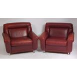 A pair of 1960s Danish tan leather armchairs,