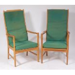 A pair of Swedish 1960s light oak ladderback open armchairs, by AB Bjarnums Mobelfabrikken, w.64.