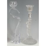 A contemporary London Glassworks clear heavy glass candlestick, of trailing S form,