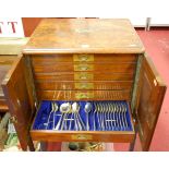 A Victorian figured walnut and well-fitted six drawer cutlery canteen and part contents,