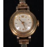 A Longines 9ct gold cased ladies wristwatch, having a signed silvered dial (scratched to centre),