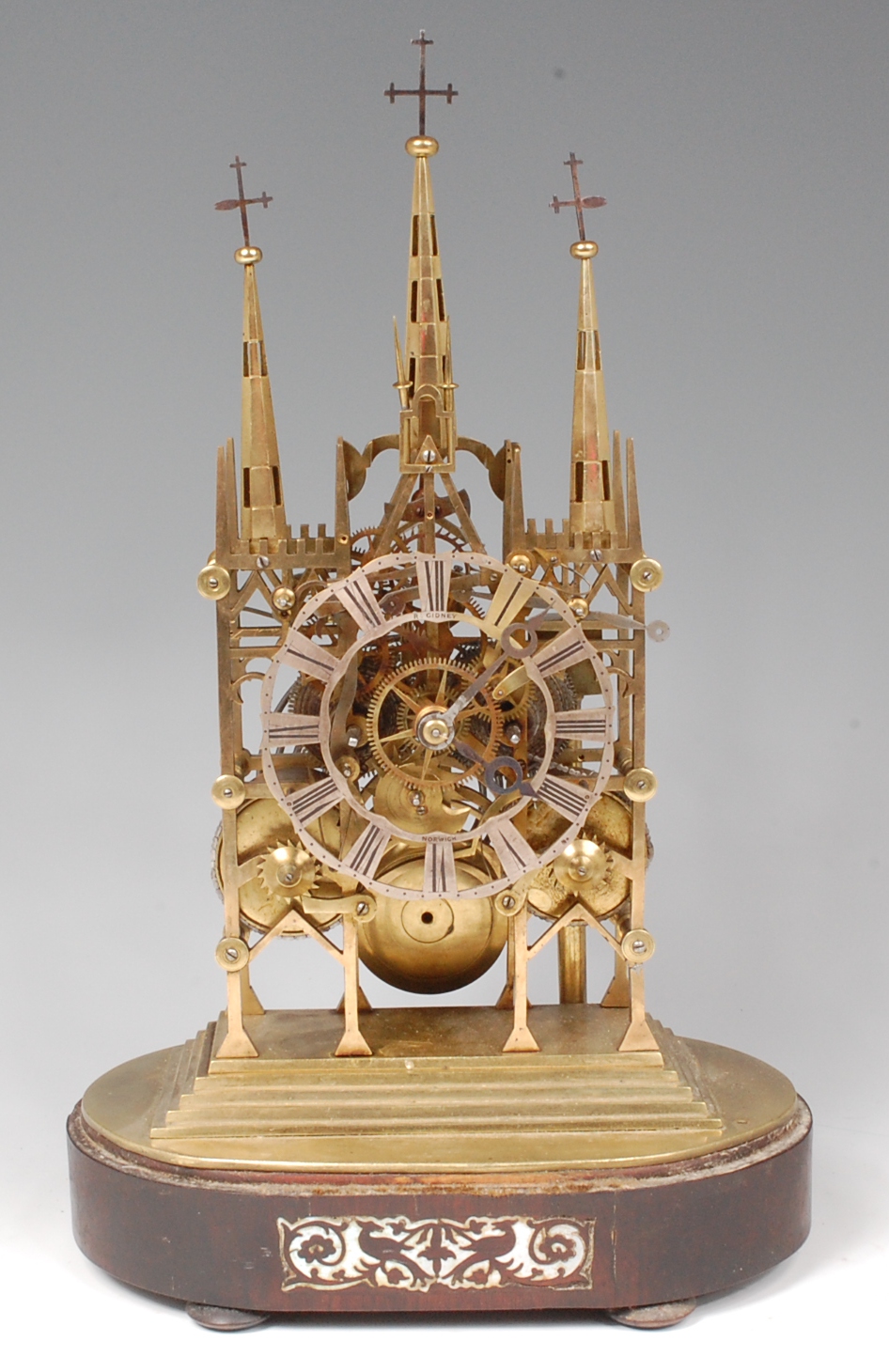 Robert Gidney of Norwich circa 1830 brass cathedral skeleton clock, having signed silvered dial,