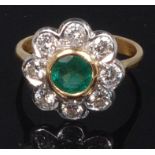 An 18ct gold, emerald and diamond flower head cluster ring,