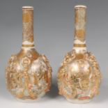 A pair of Japanese Meiji period satsuma bottle vases and covers,
