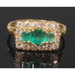 An 18ct gold, emerald and diamond dress ring,