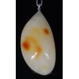 A large polished amber pendant, 61x31x21mm,