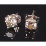 A pair of 18ct white gold and diamond ear studs,