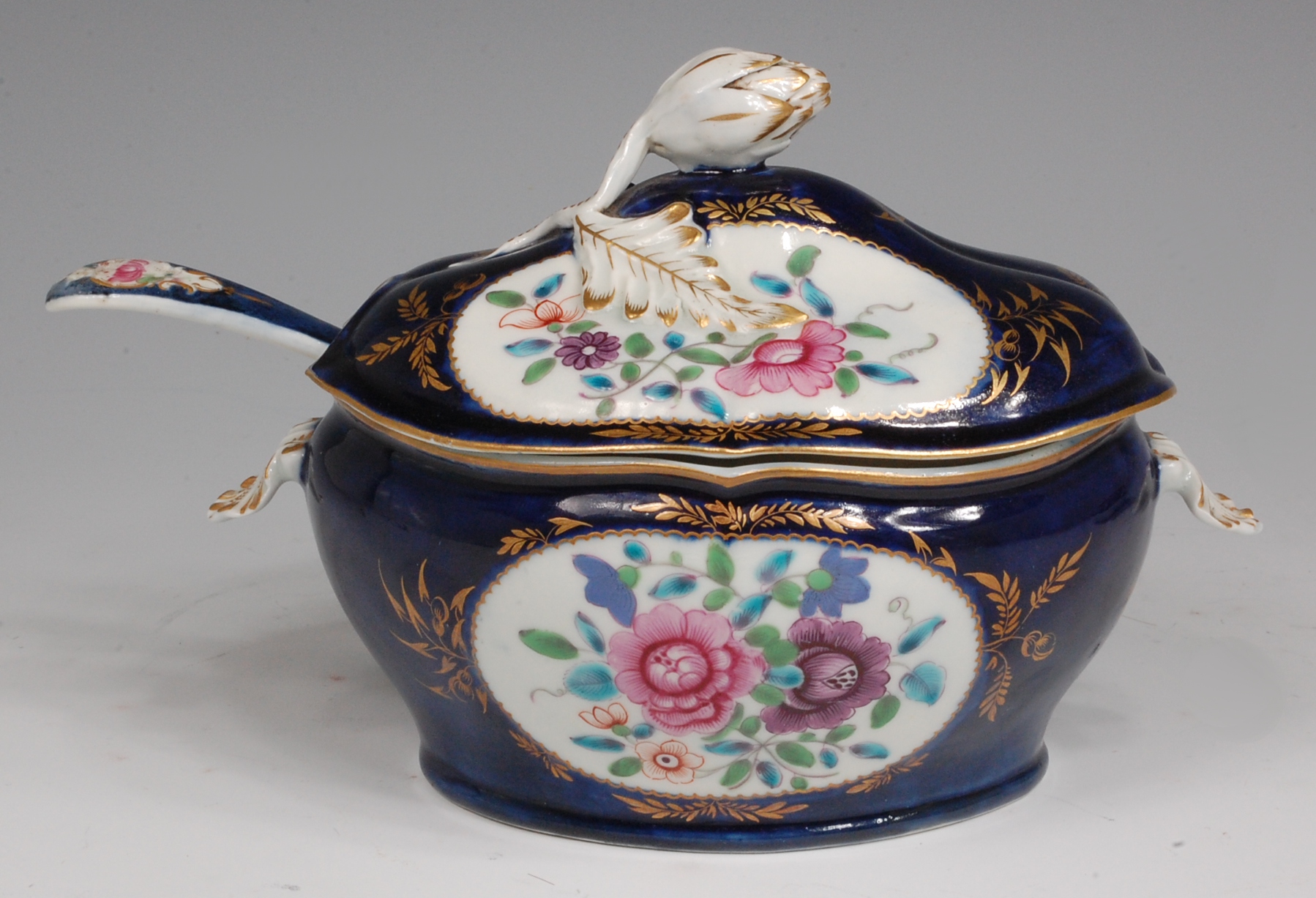 A first period Worcester sauce tureen and cover, with ladle, the cover with artichoke knop,