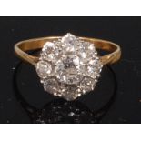 An early 20th century yellow metal and diamond cluster ring,