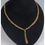 A modern 18ct gold multi-string necklace, with tassel pendant, 19.