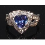 A contemporary 14ct white gold, tanzanite and diamond set dress ring,