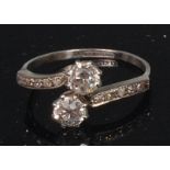 A platinum ladies diamond crossover ring,