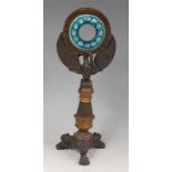 A Regency period bronze and gilt bronze 'candle' clock case (lacking movement),