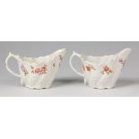 A pair of Lowestoft porcelain cream boats, of low Chelsea ewer form,