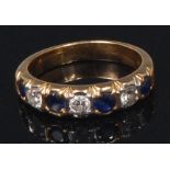 An 18ct gold, sapphire and diamond half eternity ring, arranged as seven alternating old brilliants,