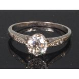 A platinum and diamond solitaire ring, the claw set brilliant weighing approx 0.