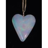 An opal pendant, the polished heart shaped pendant measuring approx 21x20x4mm,