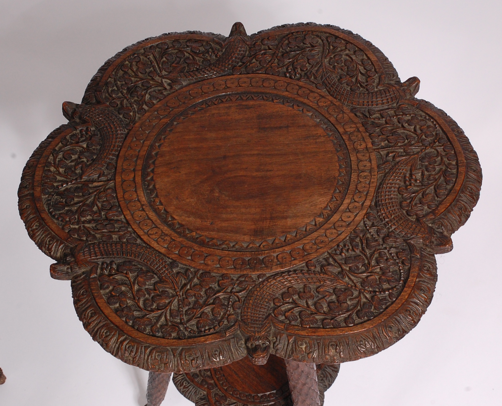A pair of circa 1900 Indian carved teak occasional tables, of shaped circular form, - Image 2 of 3