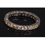 A 14ct white gold diamond eternity ring,