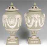 A pair of Wedgwood green jasper pedestal vases and covers,