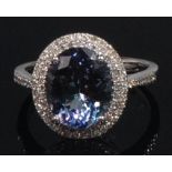 A contemporary 14ct white gold, tanzanite and diamond dress ring,