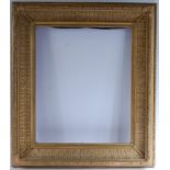 A late 19th century giltwood and gesso picture frame, the whole moulded with leaves and flowers,