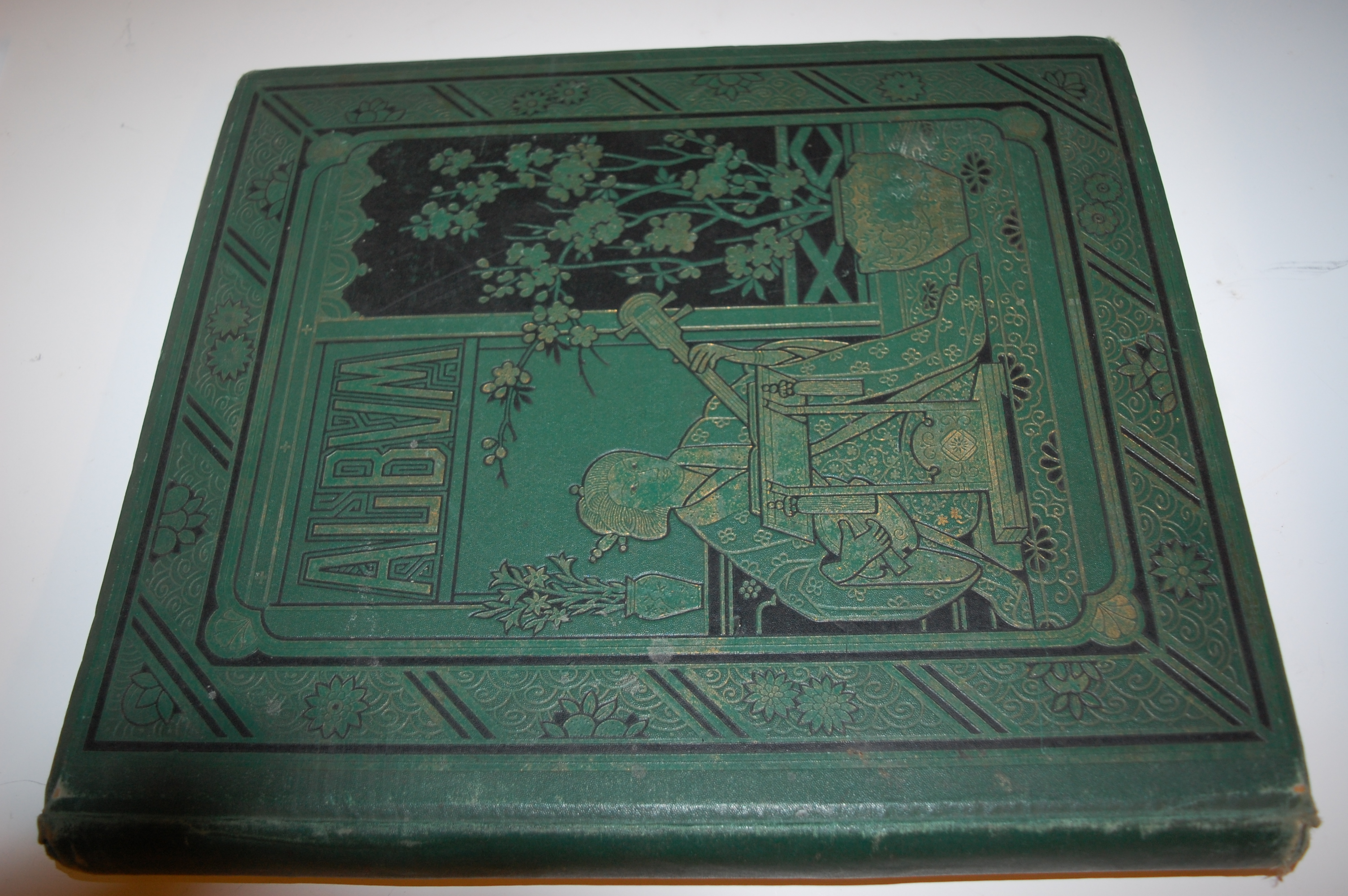 Folio album containing 14 Victorian illuminated sheets in medieval style, with calligraphy,