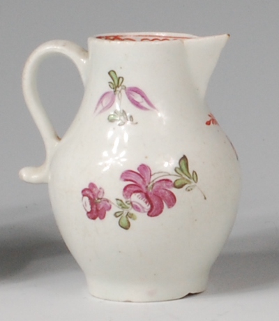 A Lowestoft porcelain sparrowbeak cream jug, polychrome decorated with stylised roses and fuchsias, - Image 2 of 2