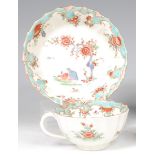 A first period Worcester teacup and saucer, each of fluted circular form,