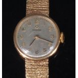 A ladies Omega 9ct gold cased bracelet watch, having signed silvered dial,