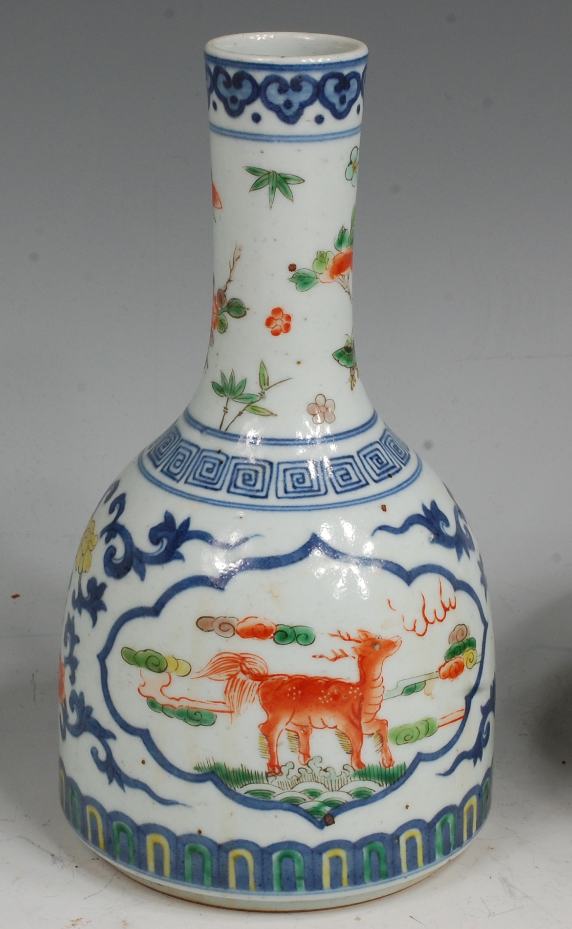 A Chinese Wucai mallet vase, the body painted with opposing reserves of mythical beasts,