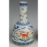 A Chinese Wucai mallet vase, the body painted with opposing reserves of mythical beasts,