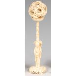 A circa 1900 Chinese carved and pierced ivory puzzle ball on stand,