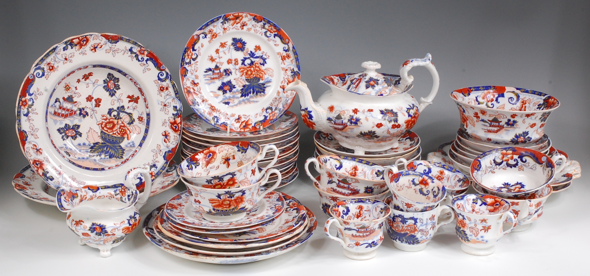 An early 19th century Minton Amherst Japan pattern part tea service, comprising; teapot (riveted),