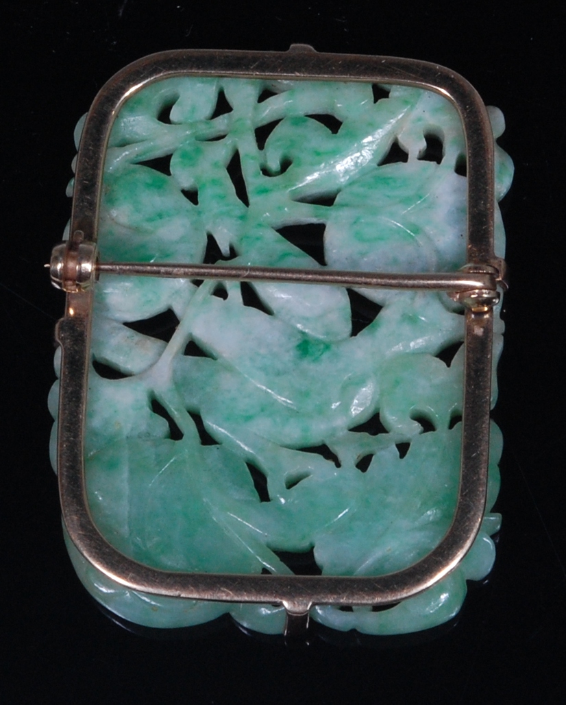 A Chinese celadon and green jade brooch, in yellow metal mount, carved as a bird amidst fruit, - Image 2 of 2