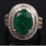 A contemporary 14ct gold, emerald and diamond dress ring,