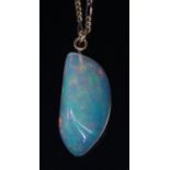 A large polished opal pendant, the three-sided opal measuring approx 30 x 15 x 9mm,