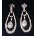 A pair of 18ct white gold, diamond and pearl ear pendants, each of pierced teardrop shape,