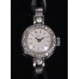 A ladies Ebel platinum cased diamond set cocktail watch, having signed circular dial, baton markers,