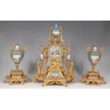 A 19th century French gilt metal and porcelain three-piece clock garniture,