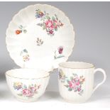 A first period Worcester trio, comprising tea bowl, saucer and coffee can, each of fluted form,