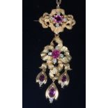 A yellow metal, pink sapphire and diamond set pendant brooch,