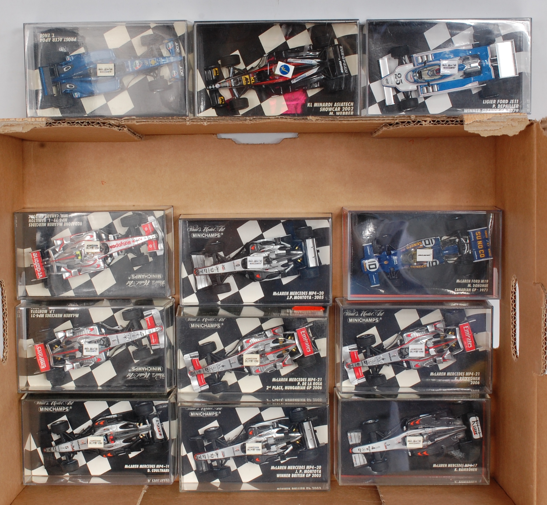 Minichamps 1/43rd scale Formula 1 Group, 12 plastic cased examples, to include Mclaren Mercedes,