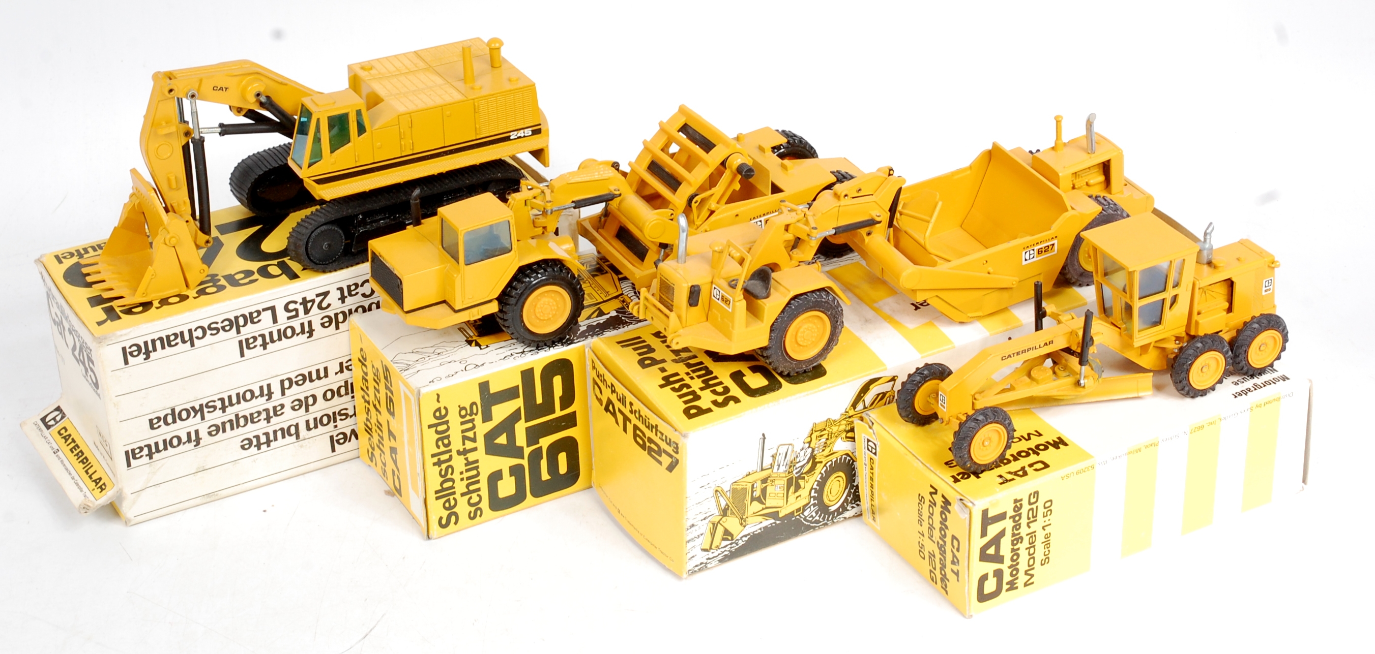 NZG 1/50th scale Caterpillar Construction diecast group, 4 boxed examples to include No.