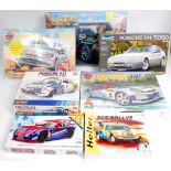 12 mixed scale plastic car kits, mixed manufacturers to include Burago, Airfix, Hornby,