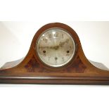 An Edwardian and mahogany and chequer strung mantel clock having silvered dial with Arabic numerals